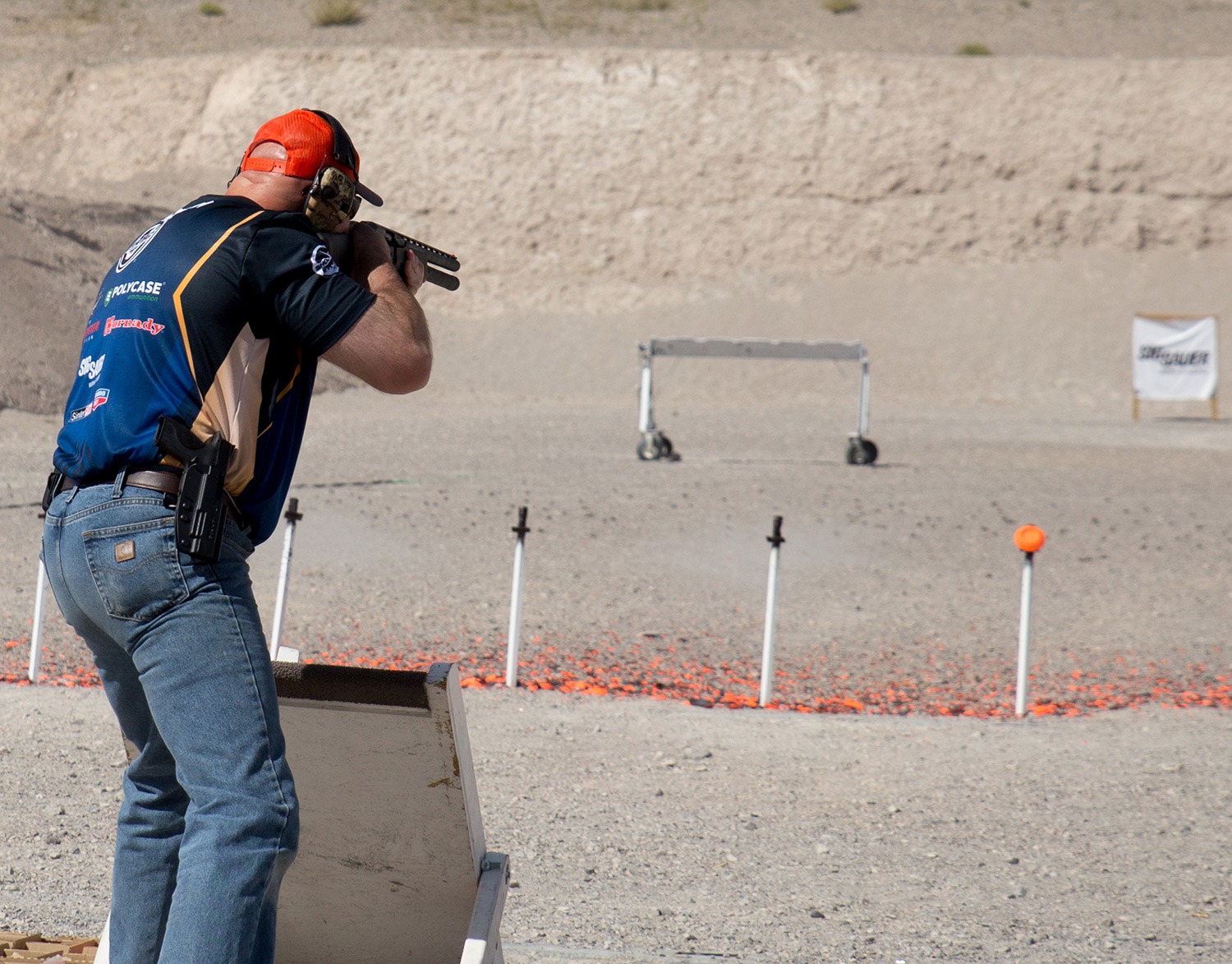 Man Shooting Shotgun at range target