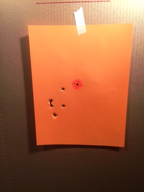 Paper target with scattered hits between 6 & 9 o'clock
