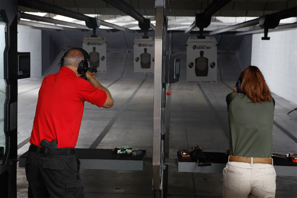 Nashville Armory range behind a male and female shooter