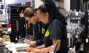 Two ATF agents conducting an inspection in a firearm retailer.