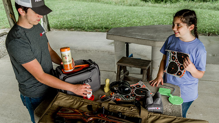 Gun Cleaning Instruction at an outdoor range