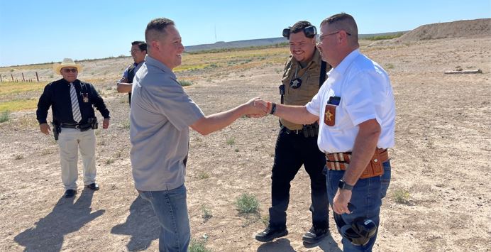 Texas U.S. Representative Tony Gonzales shaking hands with the Pecos county sheriff