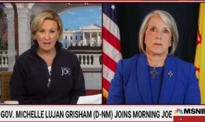 A screenshot of MSNBC's Morning Joe with two New Mexico Democrat Governor Michelle Lujan Grisham. A lower-third reads, "Gov. Michelle Lugan Grisham (D-NM) Joins Morning Joe"